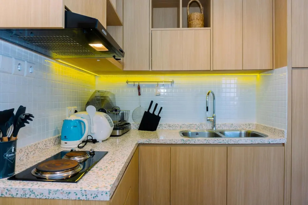 Spacious 1BR with Japandi Design at West Vista Apartment By Travelio
