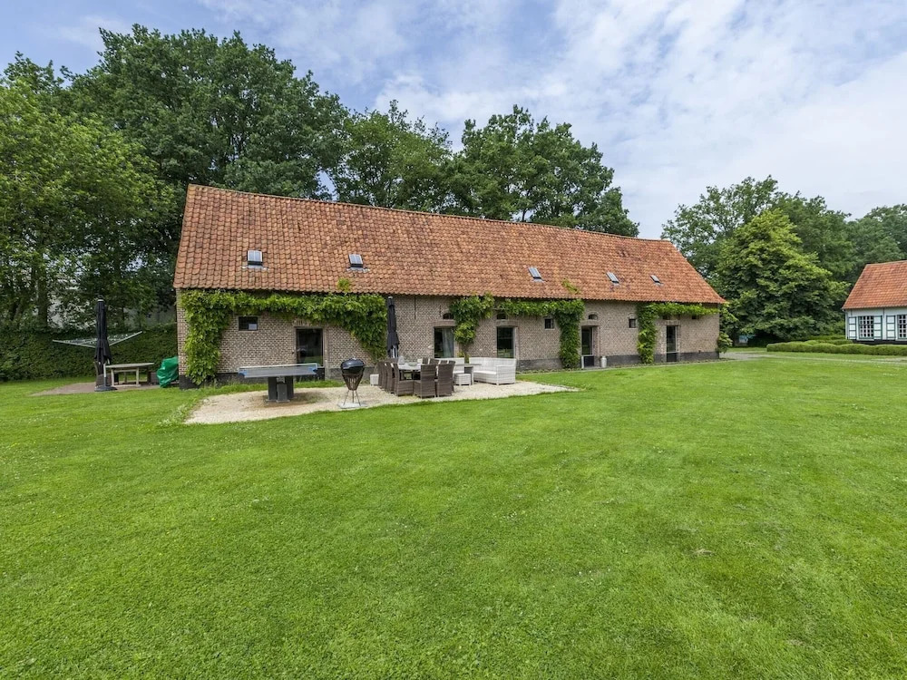 beautifull renovated farmhouse with traditional elements and a big garden
