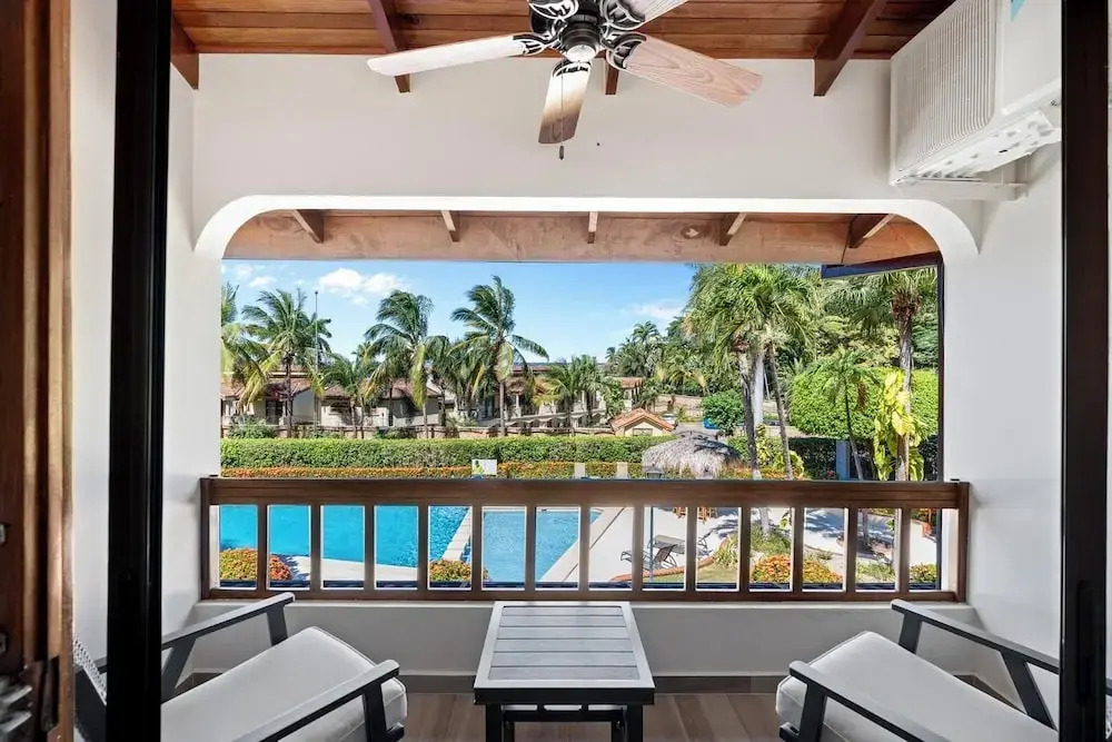 Stylish 2-Bedroom Beach Condo with Ocean-View Deck, Lush Pool Area & 2-Minute Walk to Flamingo Beach