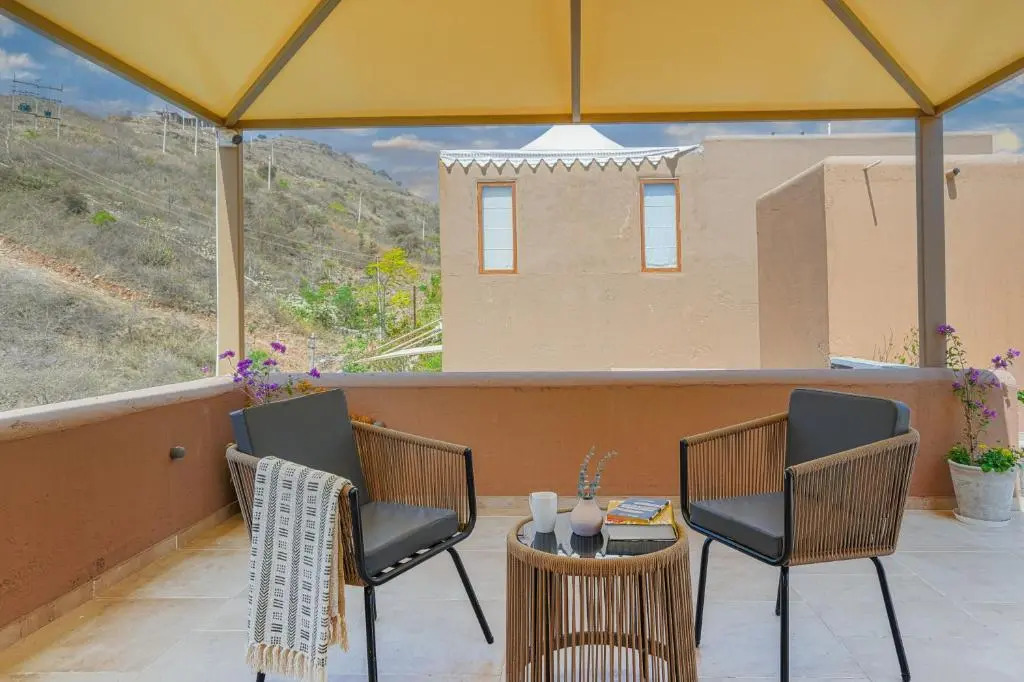 SaffronStays Moringa WishingTree - 3-BR villa near Nathdwara with pool, lawn and hillside views