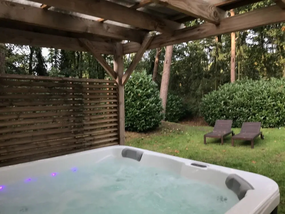 Detached villa with enclosed wooded garden with lawn, jacuzzi and infrared sauna