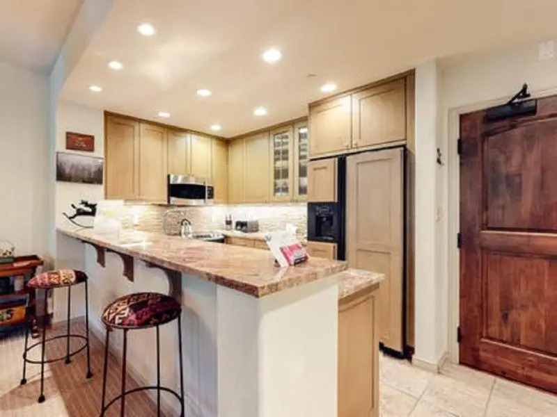 Upscale Ski in, Ski out 1 Bedroom Mountain Vacation Rental With Access to Outdoor Heated Pool, Hot Tubs, and Private Ski Lockers
