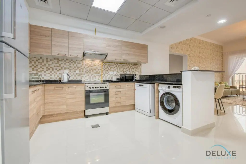 Sunny 1BR at Canal Residences West Dubai Sports City by Deluxe Holiday Homes