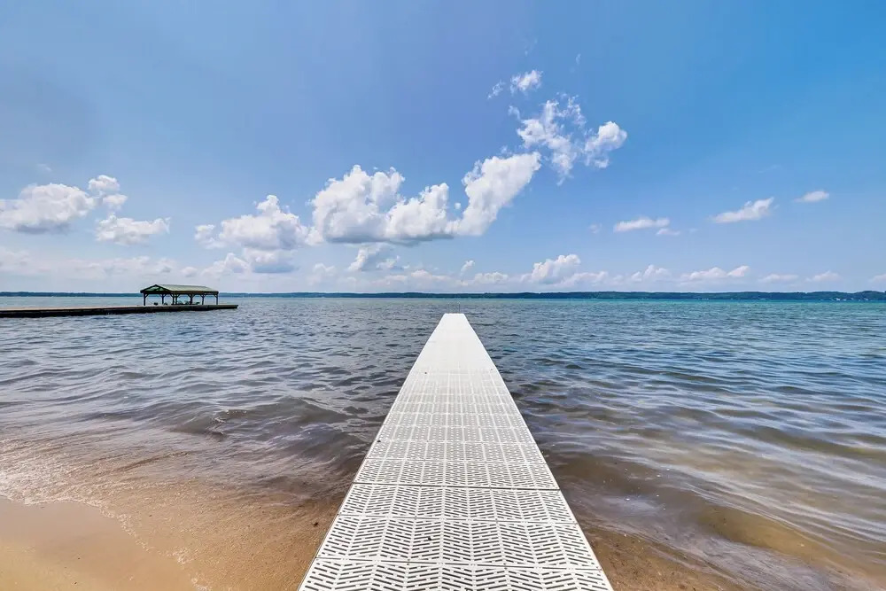 Torch Lake Getaway w/ Private Beach + Boat Dock!
