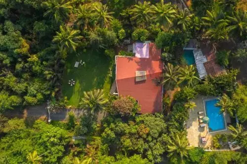 The Beach House by StayVista with Modern interiors, nearby beach, pool, lawn