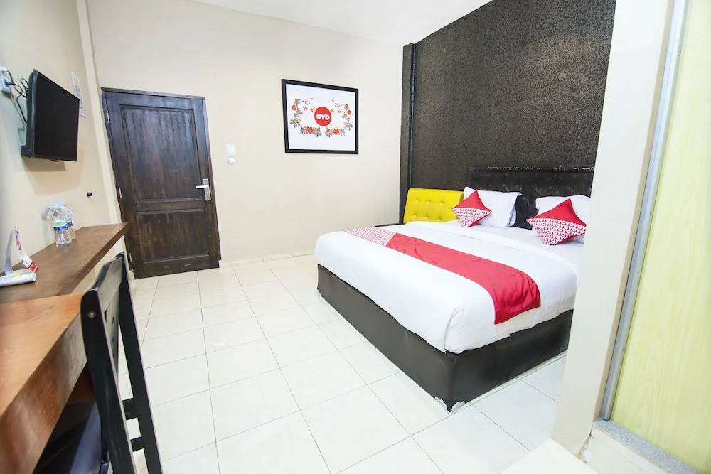 Coin Mulia Hotel By OYO Rooms