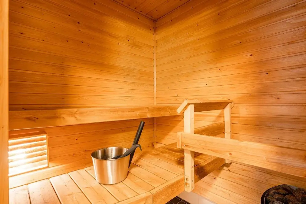Top Floor 1BR Home with Parking, Sauna and Balcony