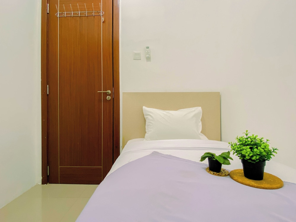 Compact White 2Br Near Rawa Buaya Station At Vittoria Residence