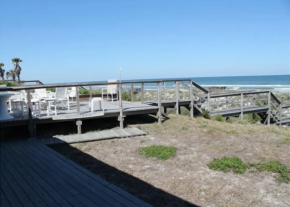 Ocean front Vacation Home with a large screened-in Patio by RedAwning