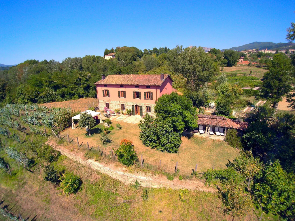 A nice rural house surrounded by hills and fields