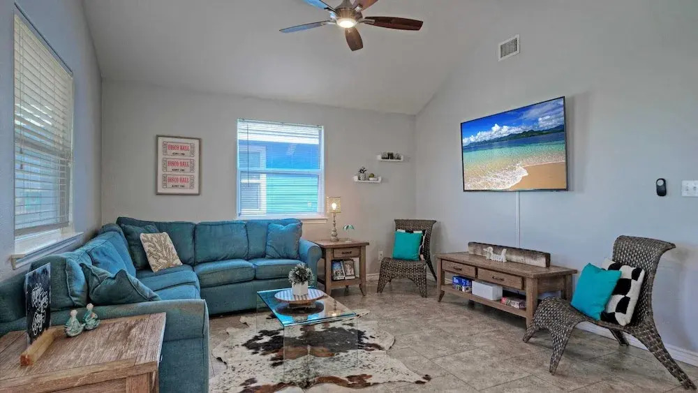 Bright Coastal Escape w/ Games, Swing Chairs & Minutes to Port A Beach Captain Kirk by Avantstay