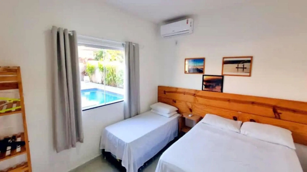 Casa de 4 suítes com piscina e área gourmet em Porto Seguro - Casa dos Ipês