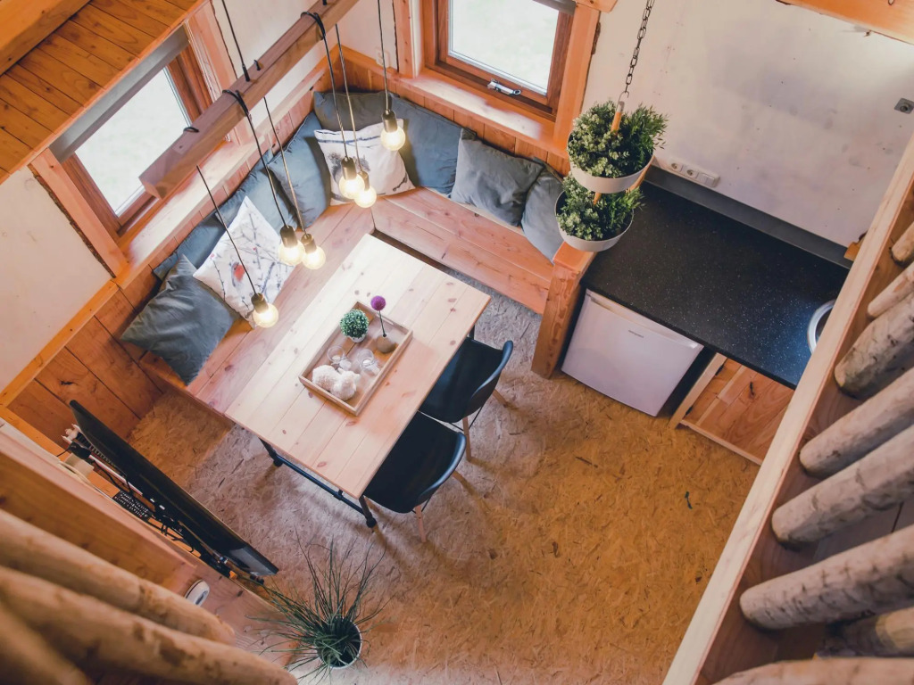 Beautiful wooden tree house with terrace in a holiday park on the river De Regge