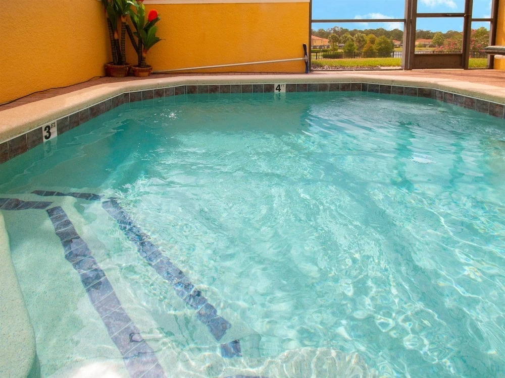 Private Screened Splash Pool Overlooking Tranquil Lake Right Beside Disney World by Florida Dream Homes