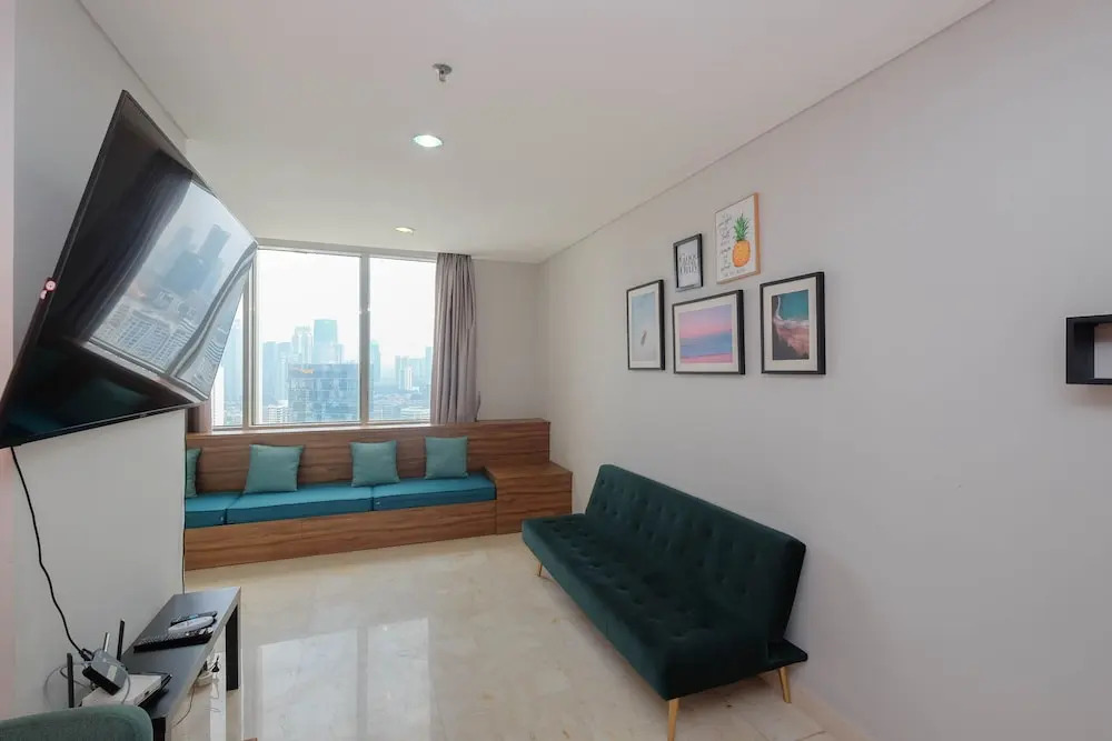 Luxury and Strategic 1BR Apartment at The Empyreal Epicentrum By Travelio