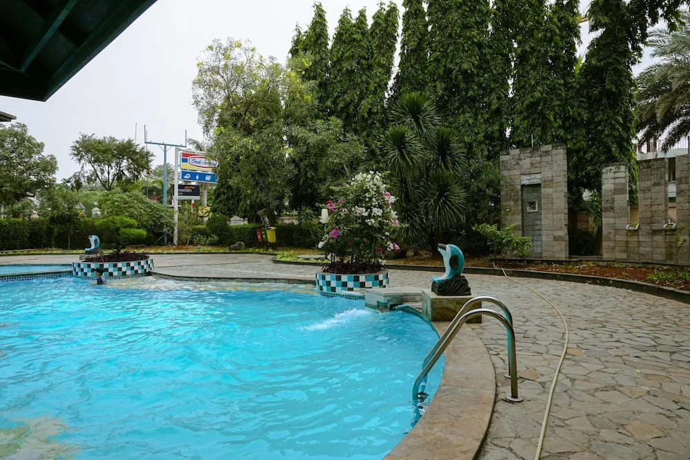 Clean and Homey 1BR at Puri Garden Apartment