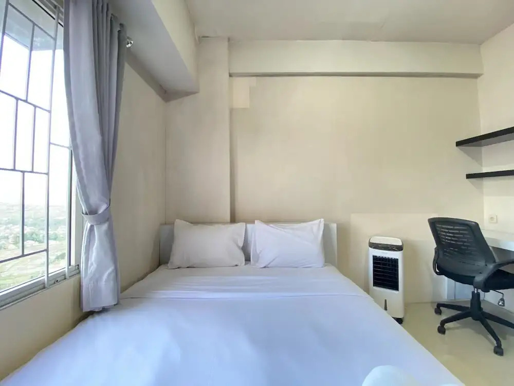 Cozy 2BR at Pinewood Apartment By Travelio