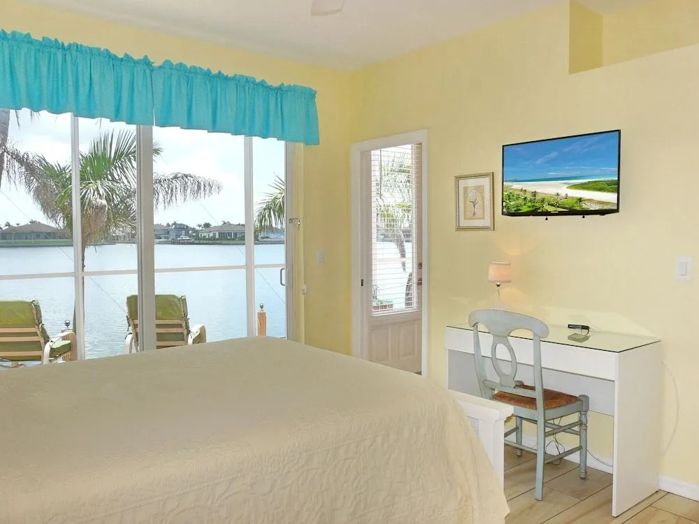 Waterfront home with views, pool and walk to beach