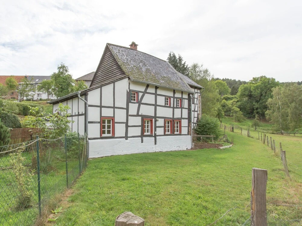 A Lovely Watermill Surrounded by Delightful Greenery
