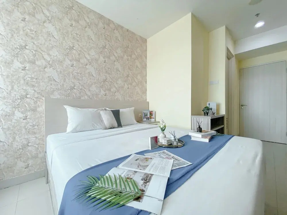 Modern and Homey 1BR without Living Room at Grand Kamala Lagoon Apartment By Travelio