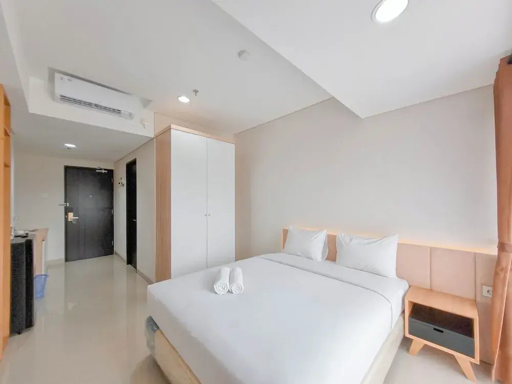 Homey Studio at Patraland Amarta Apartment By Travelio