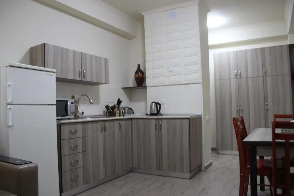 Отель Cross Apartments and Tours