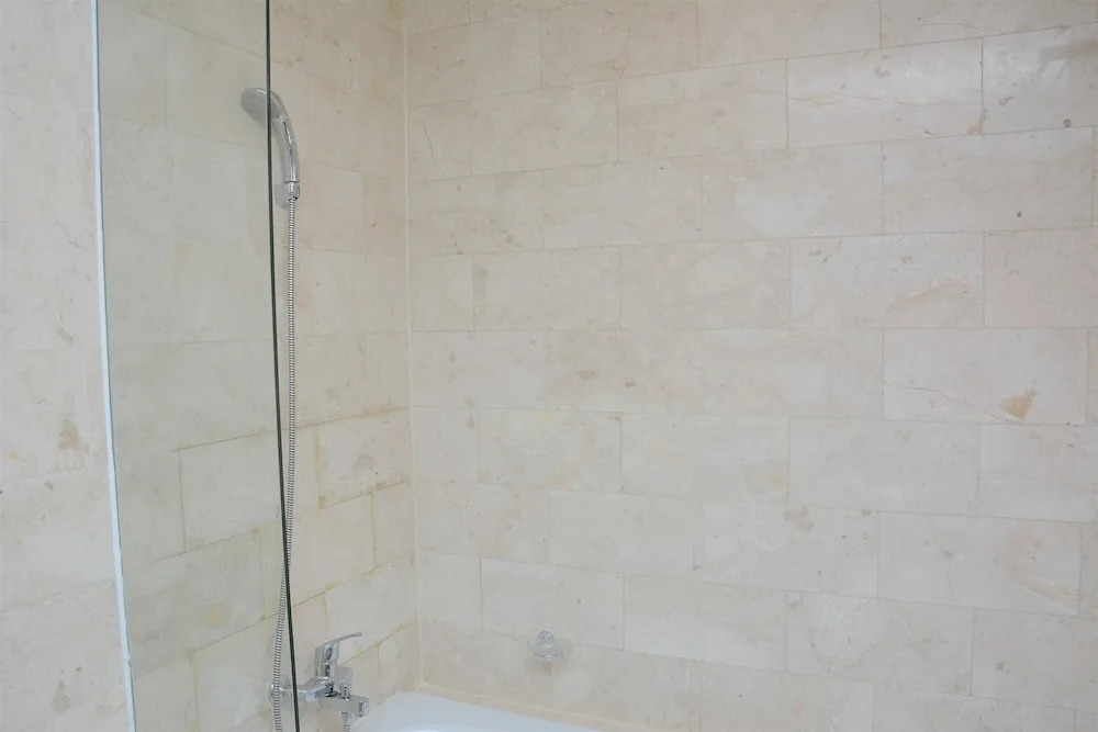 Comfy and Spacious 2BR The Masterpiece Epicentrum Apartment By Travelio