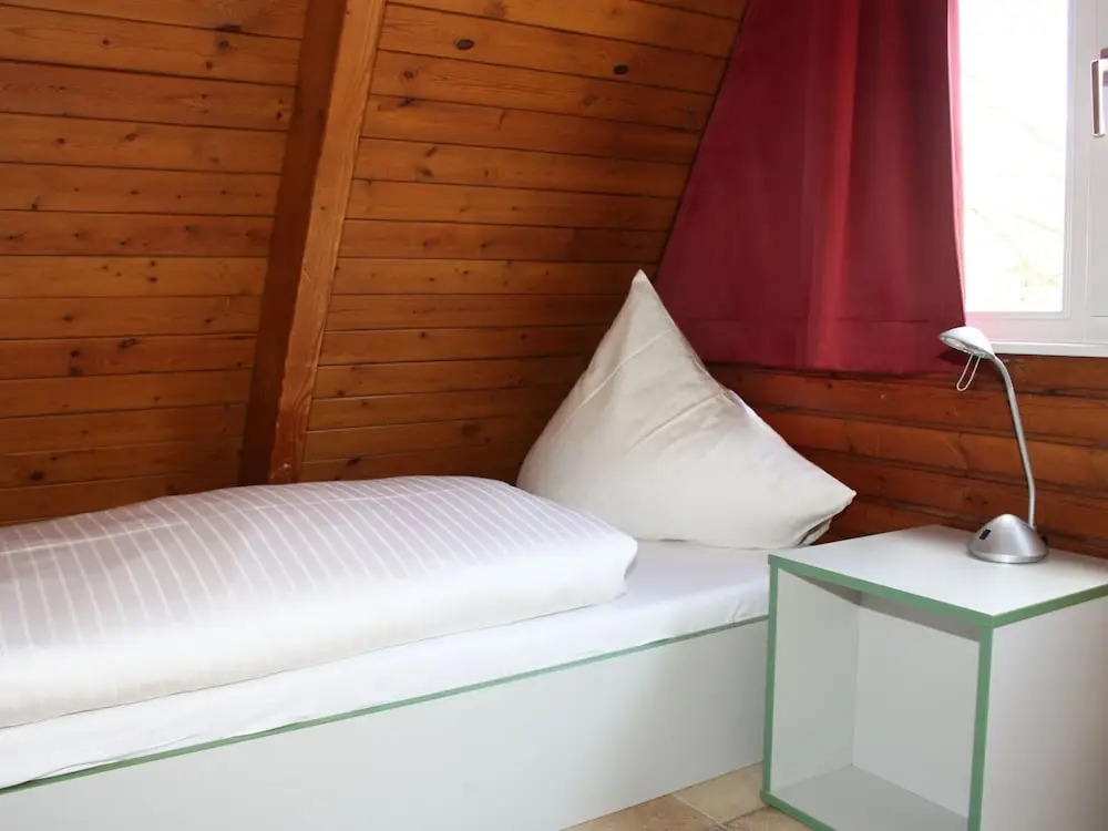 Detached holiday home, decorated with wood, on the Ostsee
