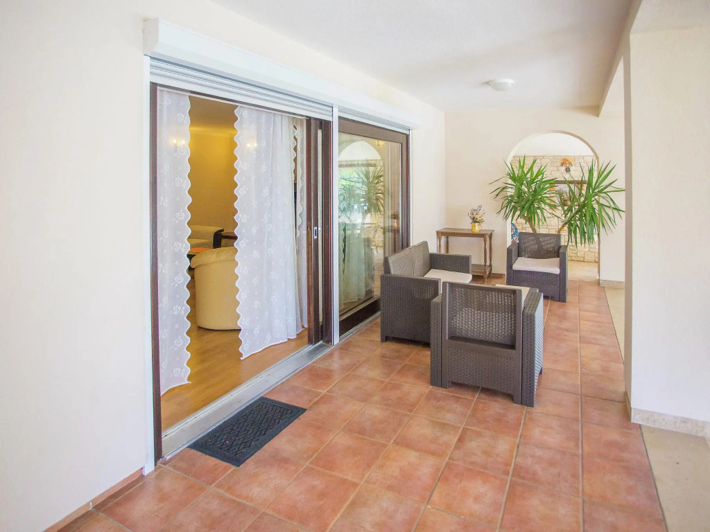 Nicely furnished apartment with covered terrace, located in front of the pool