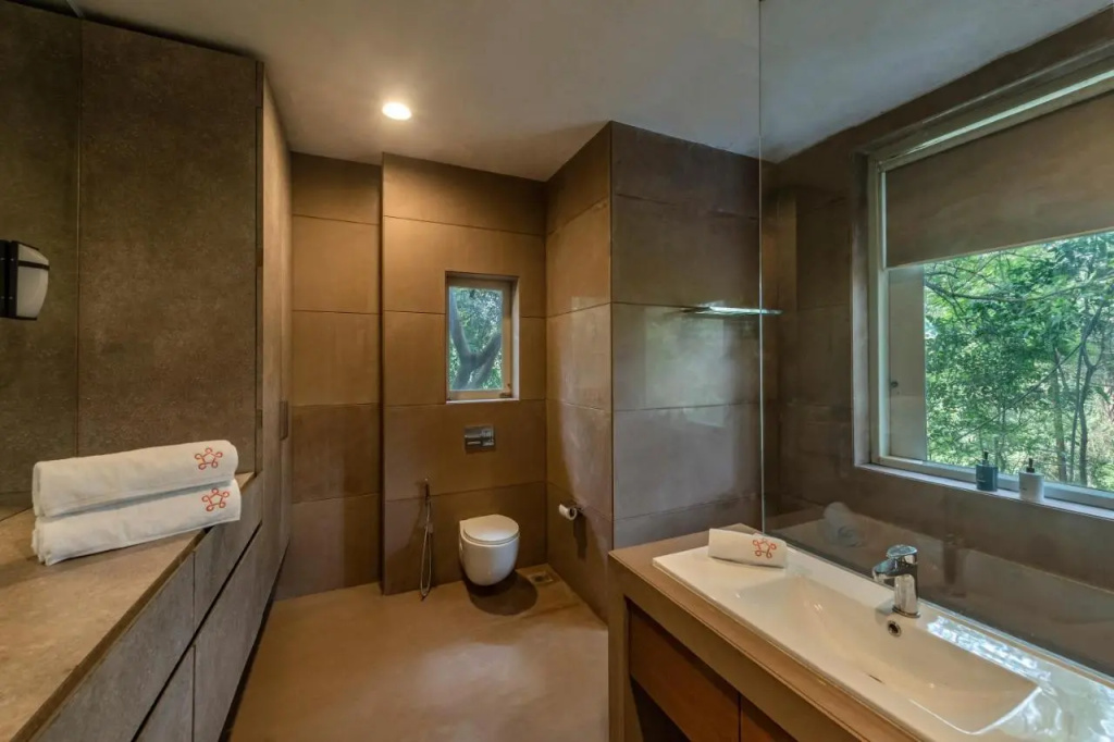 SaffronStays Odeon - 4BR heritage art deco villa with cantilever pool, verandahs & forested lawns