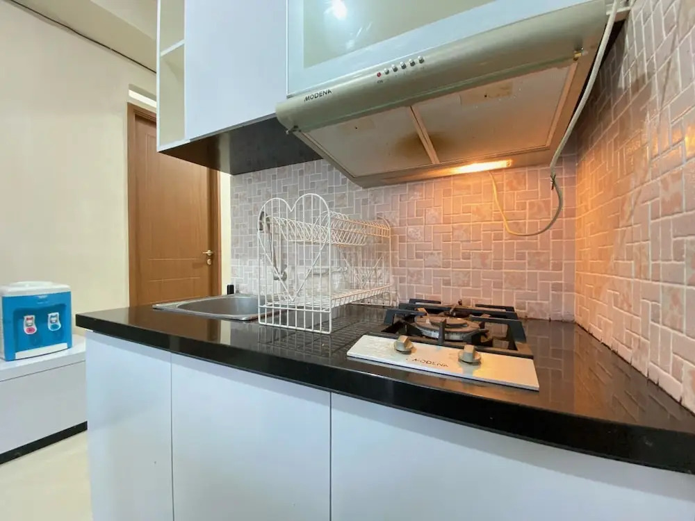 Cozy 2BR at Pinewood Apartment By Travelio