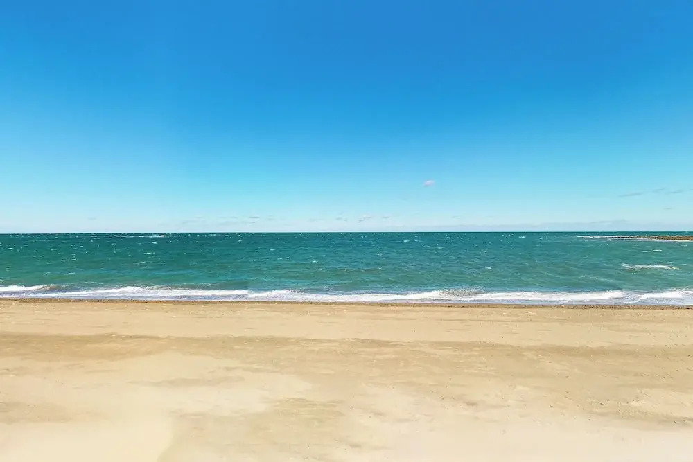 Walk to Sandhills Beach! Sunny Group Getaway