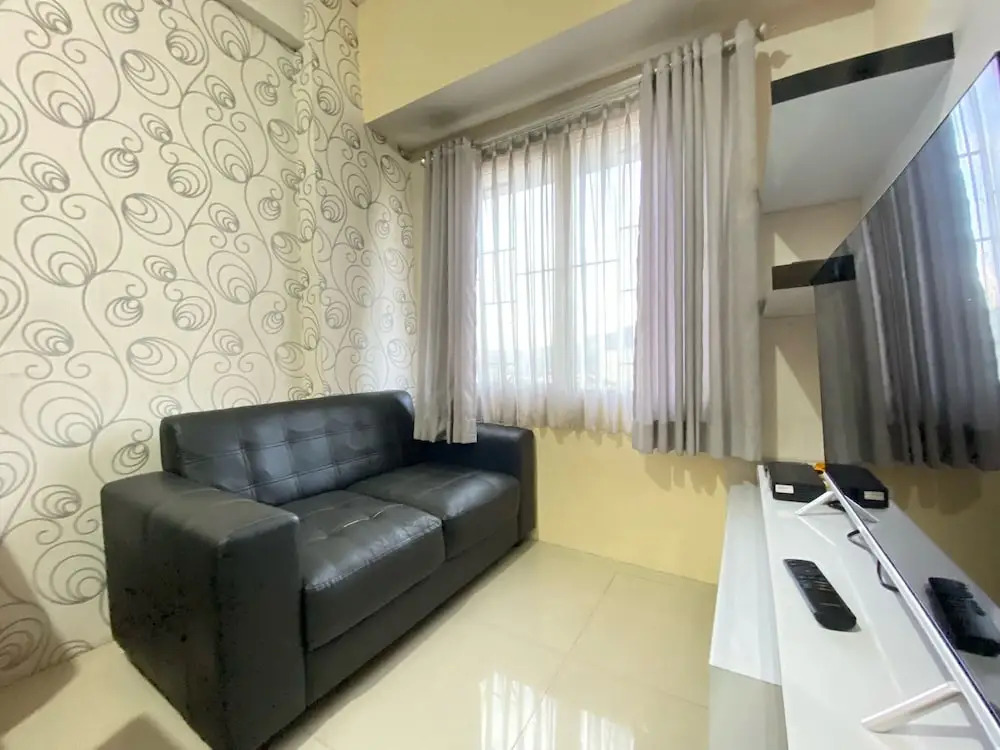 Cozy 2BR at Pinewood Apartment By Travelio