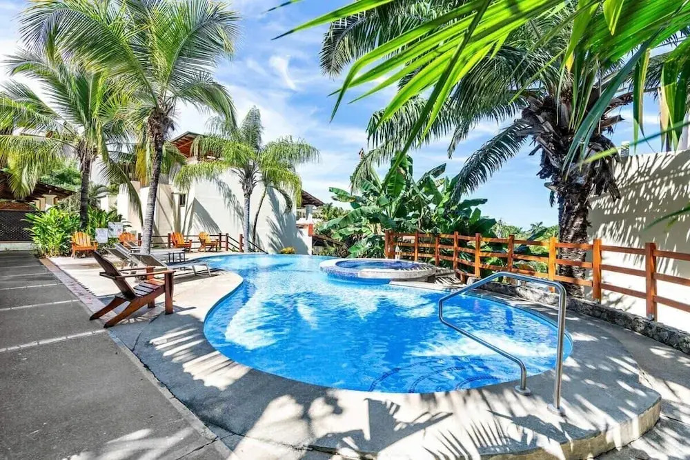 Modern Split-Level 2-Bedroom Condo with Pools, Terrace & Easy Beach Access