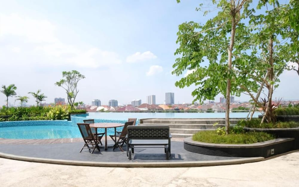 Wood Accents Studio At Grand Dharmahusada Lagoon Apartment