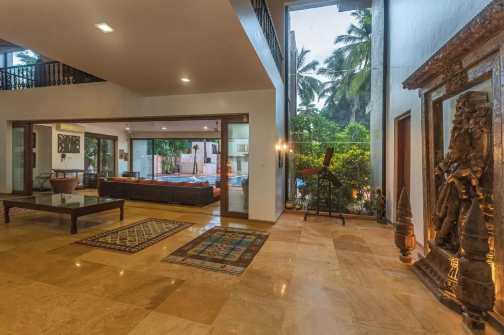 SaffronStays Casa Del Palms - 8BR luxury pool villa with gazebo, pickleball, bar & lawns near Nagaon Beach