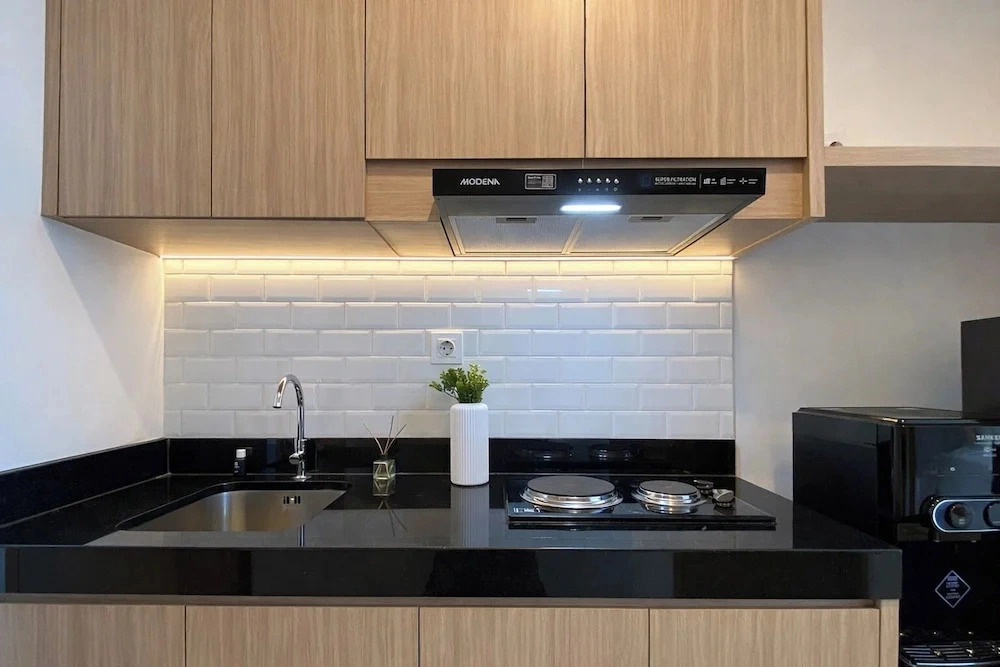 Homey Wooden Touch Studio At Apartment Ciputra World 2