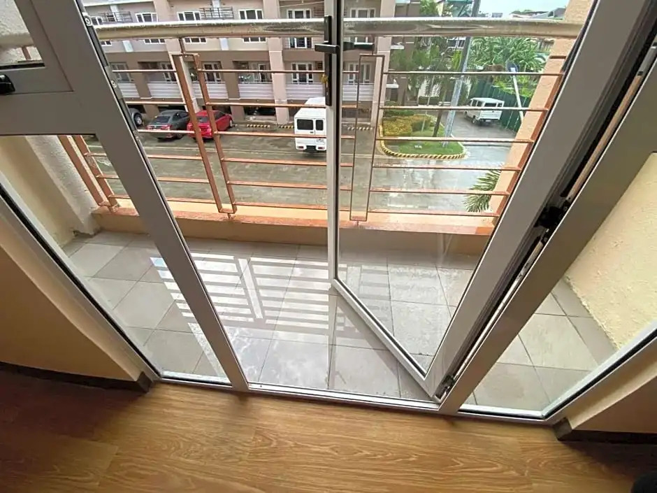 New Cozy 2 bedroom unit condotel for staycation with living room and kitchen set with pool
