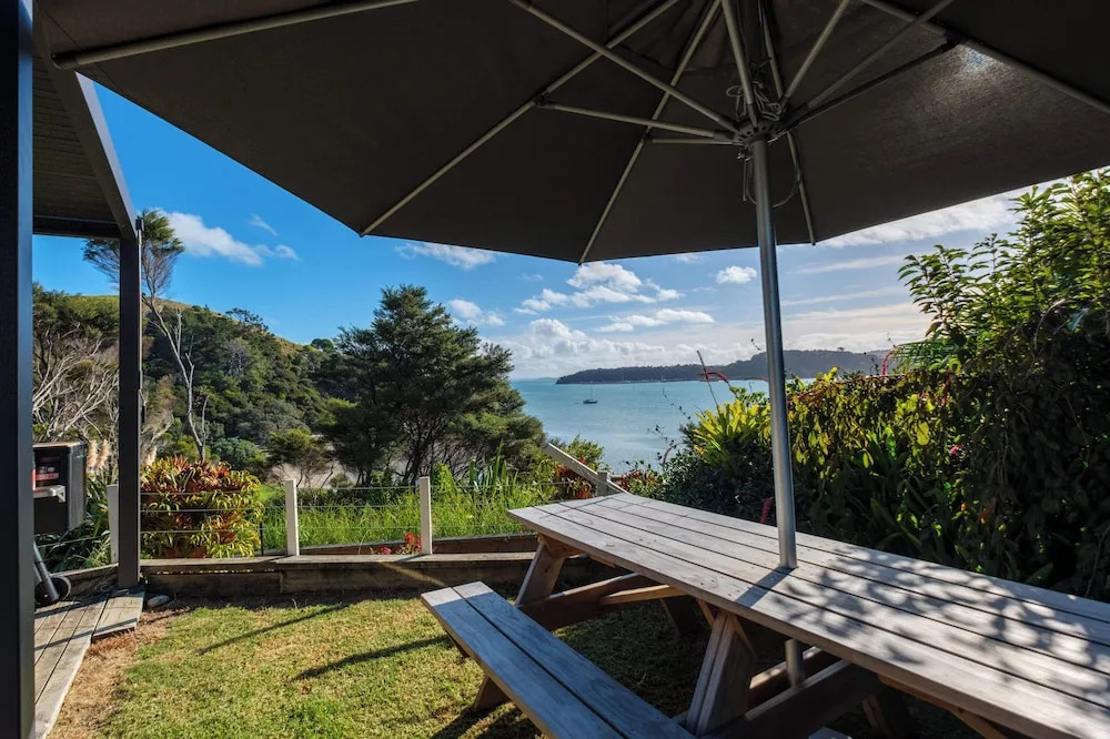 Wharetana Bay Villa with private walkway to beach
