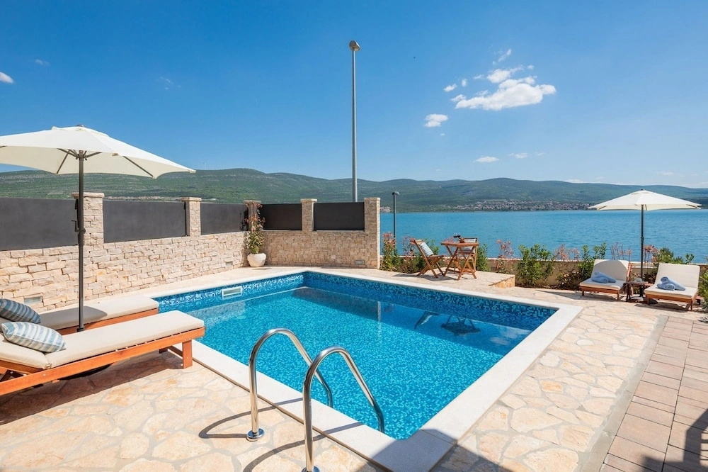 Seafront Villa Noah with heated pool