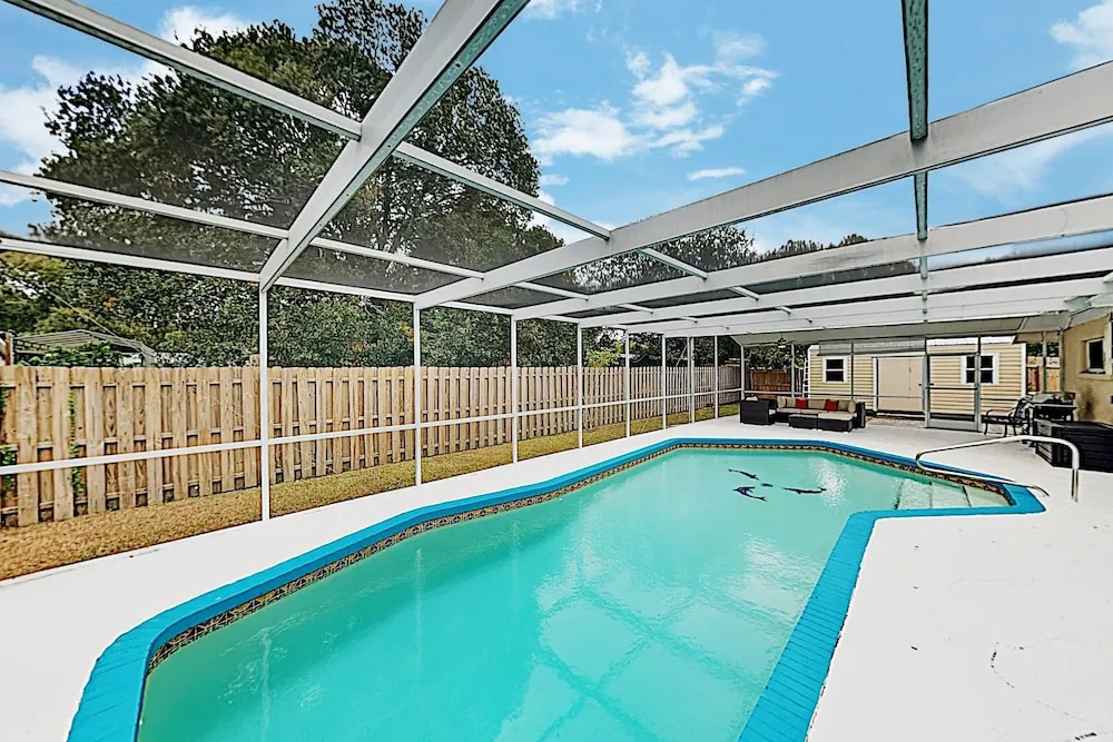 New Listing! Updated W/ Caged Pool & Patio 4 Bedroom Home