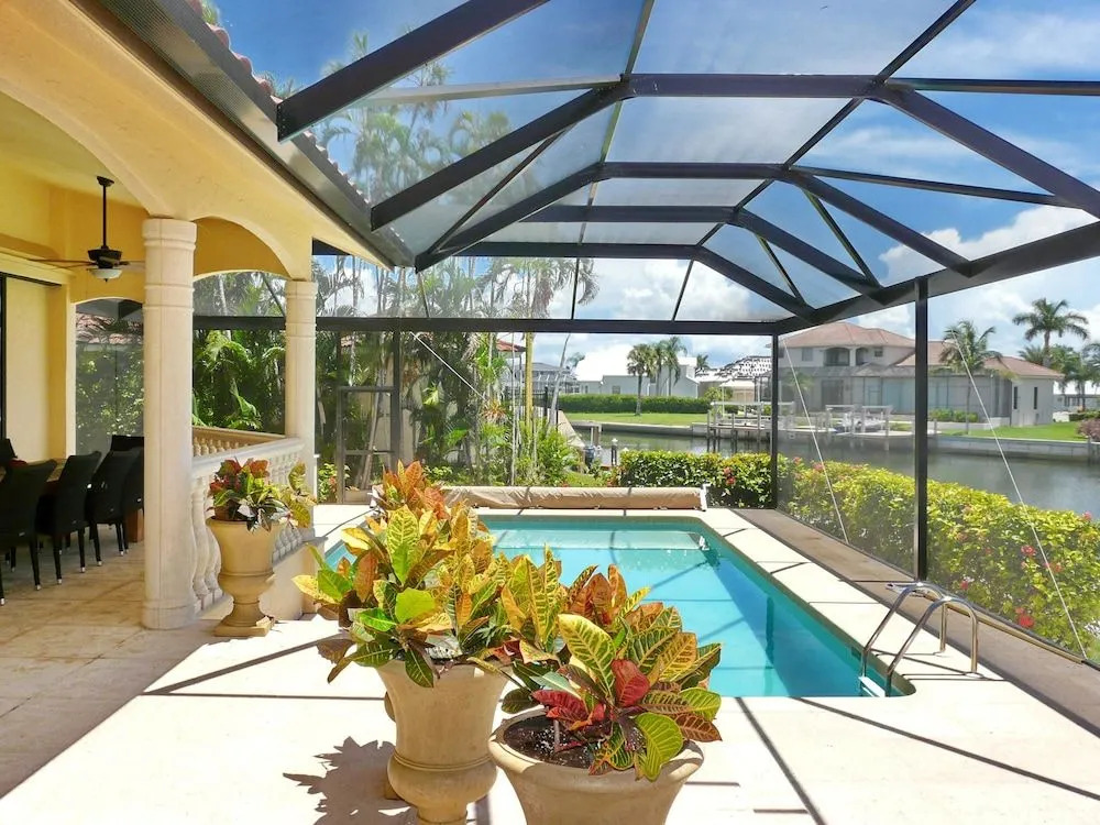 Serene waterfront home with pool, spa, and water view