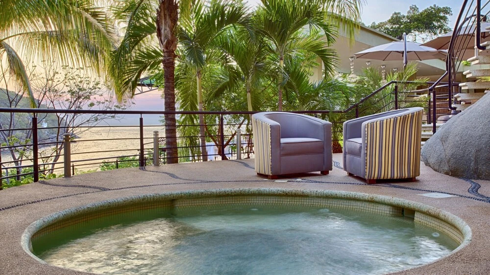 Luna Suite with two king size beds, with walk out terrace overlooking the beach