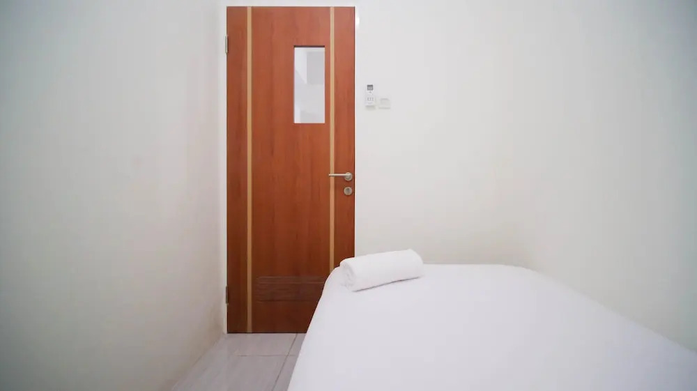 Cozy Living And Tidy 2Br At Puncak Dharmahusada Apartment