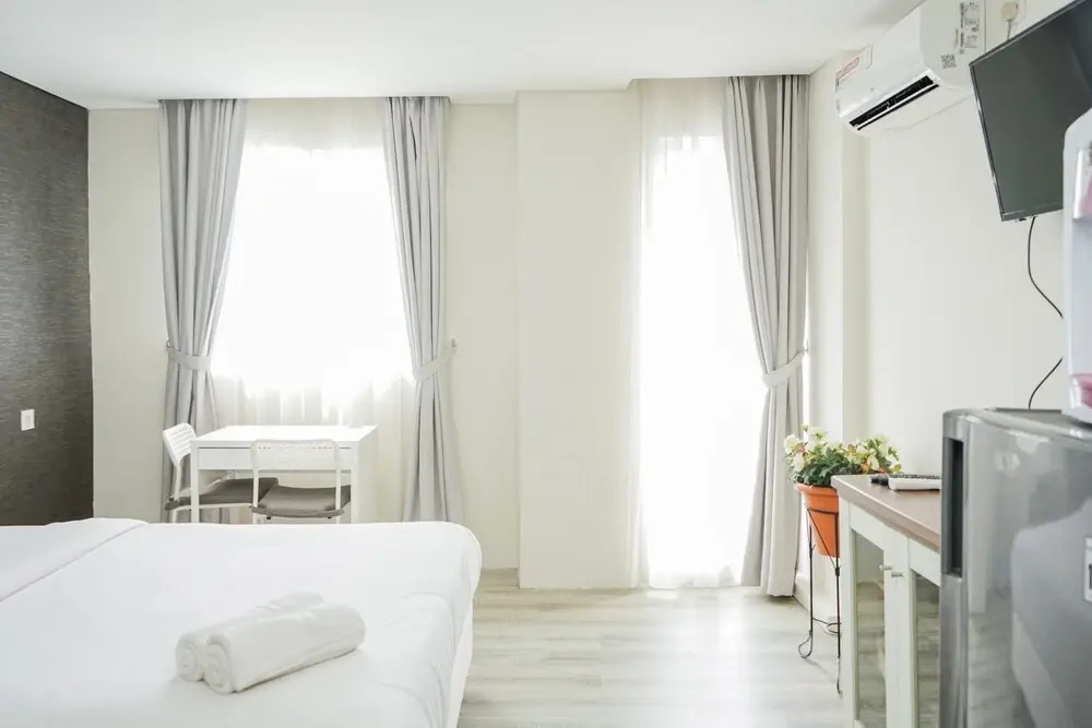 Compact and Monochrome Studio Room Bintaro Icon Apartment