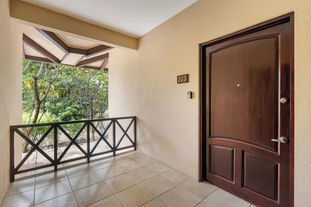 Modern Island-Themed Condo with Floor-to-Ceiling Windows & Garden and Pool Views Within Walking Distance of the Beach