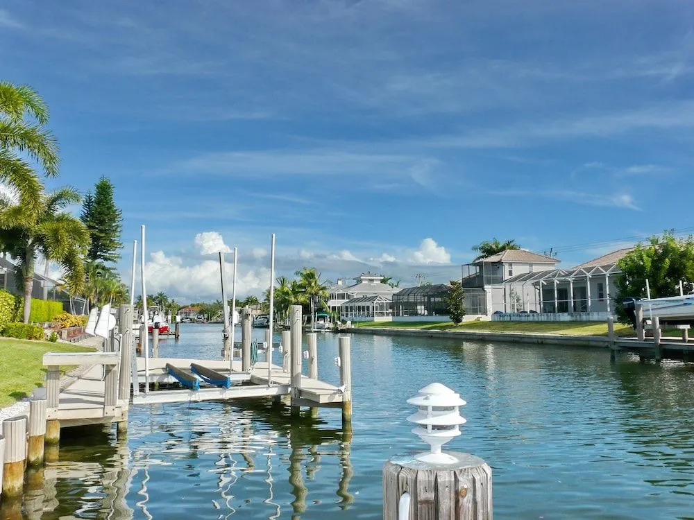 Large waterfront home with all-day sun on pool