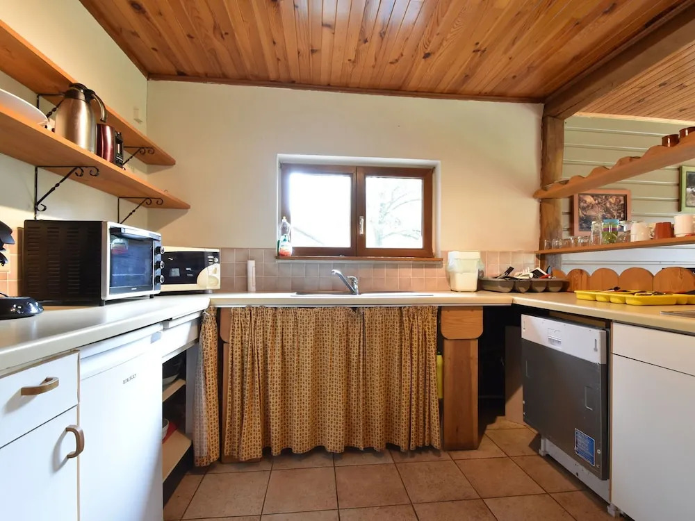 Nestled In A Green Scenery, This Chalet Along The River Is Perfect To Chill Out!