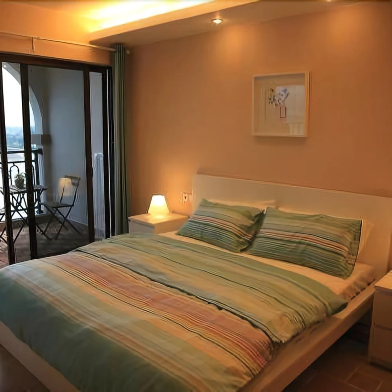 Yueming Holiday Apartment Hotel