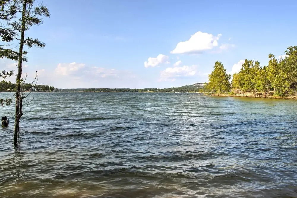 Hot Tub & Wooded Views: Lakefront Blue Eye Cottage